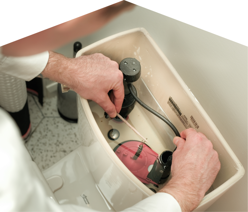 Peel plumbing specialist adjusts internal components of a toilet tank, with tile flooring visible in the background. Peel plumbing specialist adjusts internal components of a toilet tank, with tile flooring visible in the background.