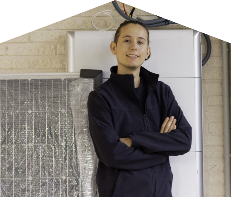 Peel specialist standing confidently with arms crossed beside newly delivered system components, including a wrapped panel and wall-mounted utility unit. Peel specialist standing confidently with arms crossed beside newly delivered system components, including a wrapped panel and wall-mounted utility unit.