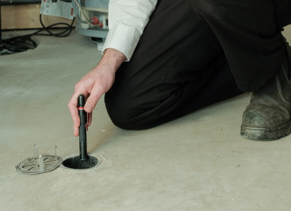 Peel service personnel inserting a diagnostic tool into a floor drain for a residential drain and sewer service check. Peel service personnel inserting a diagnostic tool into a floor drain for a residential drain and sewer service check.